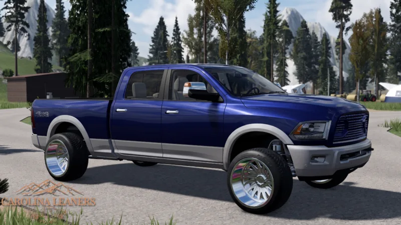 Blue and tan squatted Ram 2500 leaning back on a mountain road
